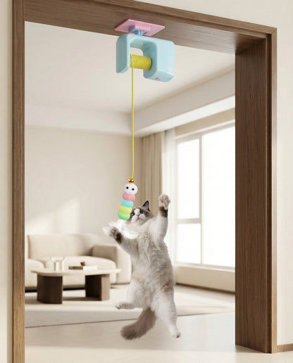 Indoor cat jumping to chase the ActivePaw DoorDrop Yo-Yo automatic hanging toy
