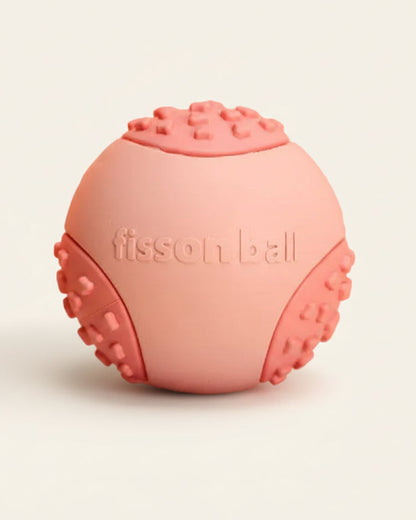ChewFlex Fetch Ball dog toy in coral color, textured grip design