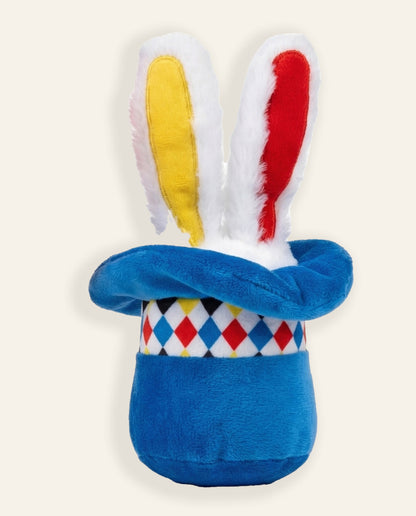 Dog holding SoftPals Circus Squeaker plush squeaky toy during indoor play