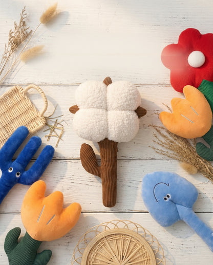 SoftPals Garden Buddy garden-inspired plush squeaky toys shown in a styled flat lay
