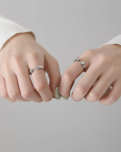 Still With Me pawprint ring worn on hand in a clean minimal lifestyle photo