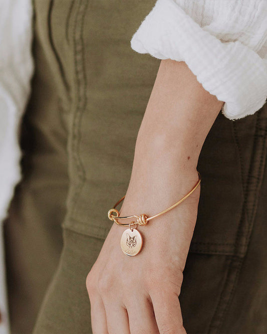 Still With Me portrait bracelet worn on wrist with a custom pet charm