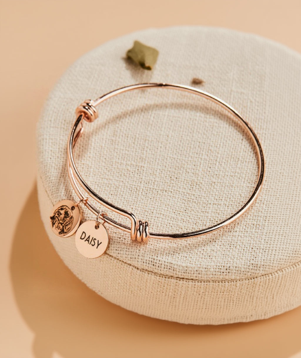 Still With Me portrait bracelet flat lay showing charm and adjustable bangle
