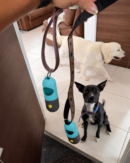 Trailblaze Glow Waste Capsule clipped to a leash for everyday walks and quick access