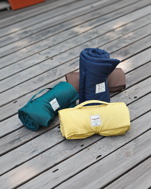 Voyager Foldaway Travel Mat folded and packed for travel and easy carry