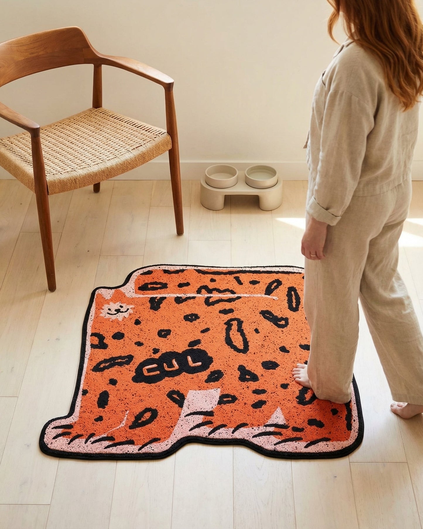 WhiskerBloom Litter Lock Mat in orange style shown on the floor for litter box area use