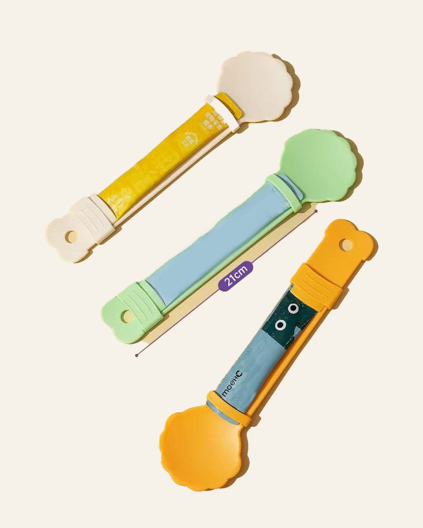 WhiskerBloom TreatStrip Spoon shown in multiple colors for cat treat stick feeding